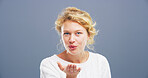 Blowing kiss, happy and portrait of woman for flirting, romance and confident on blue background. Happy, hand gesture and isolated person with emoji for love, dating and valentines day in studio