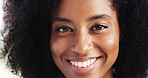 Black woman, portrait and smile in closeup, afro or beauty with natural makeup, wellness or glow in studio. African person, girl and happy with skincare, cosmetics or wellness with results in Nigeria