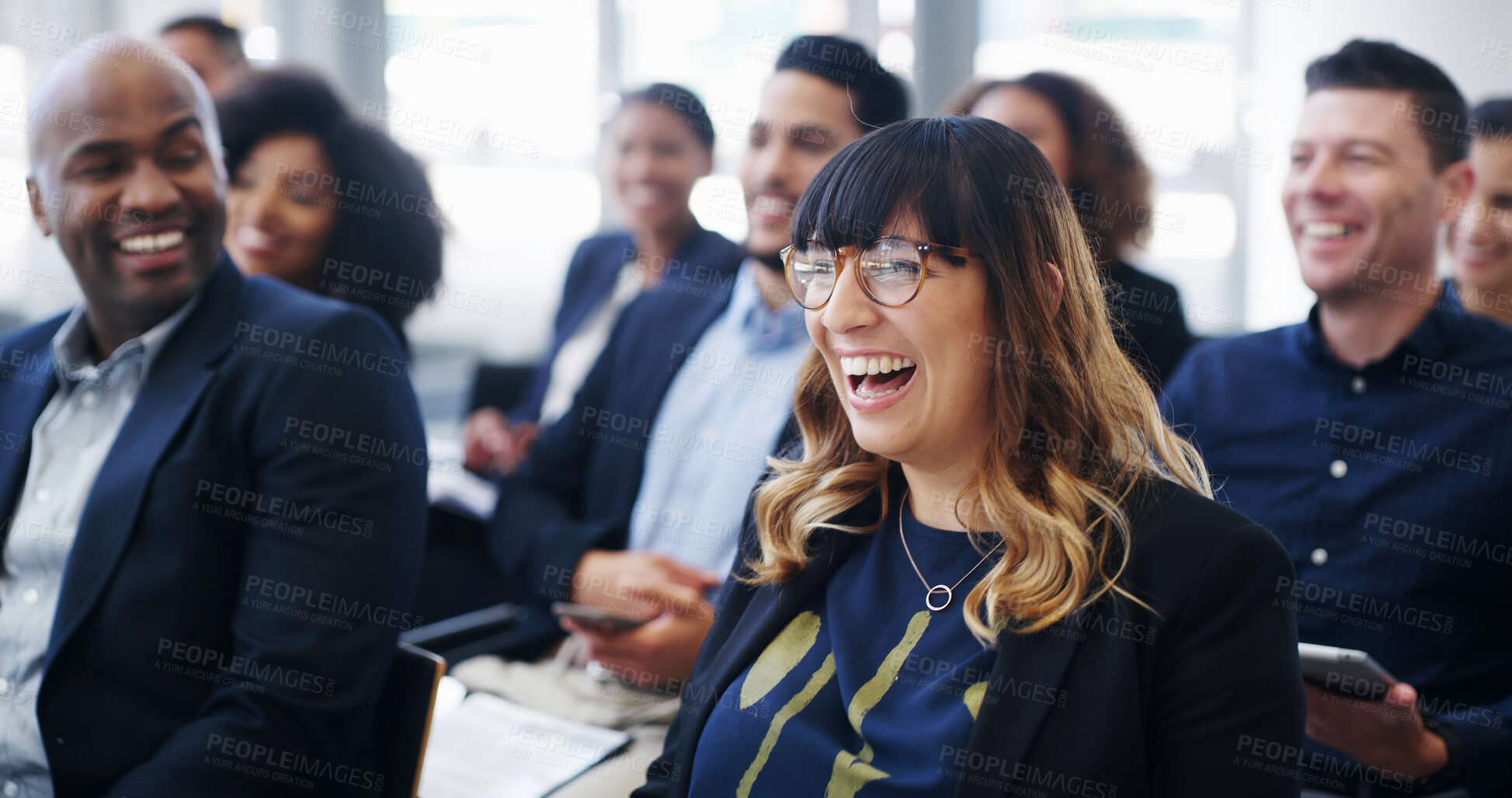 Buy stock photo Business, seminar and woman with laughing in audience for financial training, ice breaker and funny presentation. Conference room, people or happy for employee engagement, feedback joke or work event