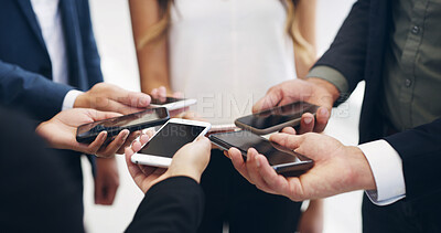 Buy stock photo Hands, business people and phone in circle at office for networking, data sync and mockup space for app. Team, together and huddle with smartphone, synergy and screen for career at corporate agency