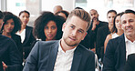 Event, convention and seminar with business man at conference for speech, discussion and workshop. Presentation, crowd and learning with group of people for corporate, tradeshow and speaker together