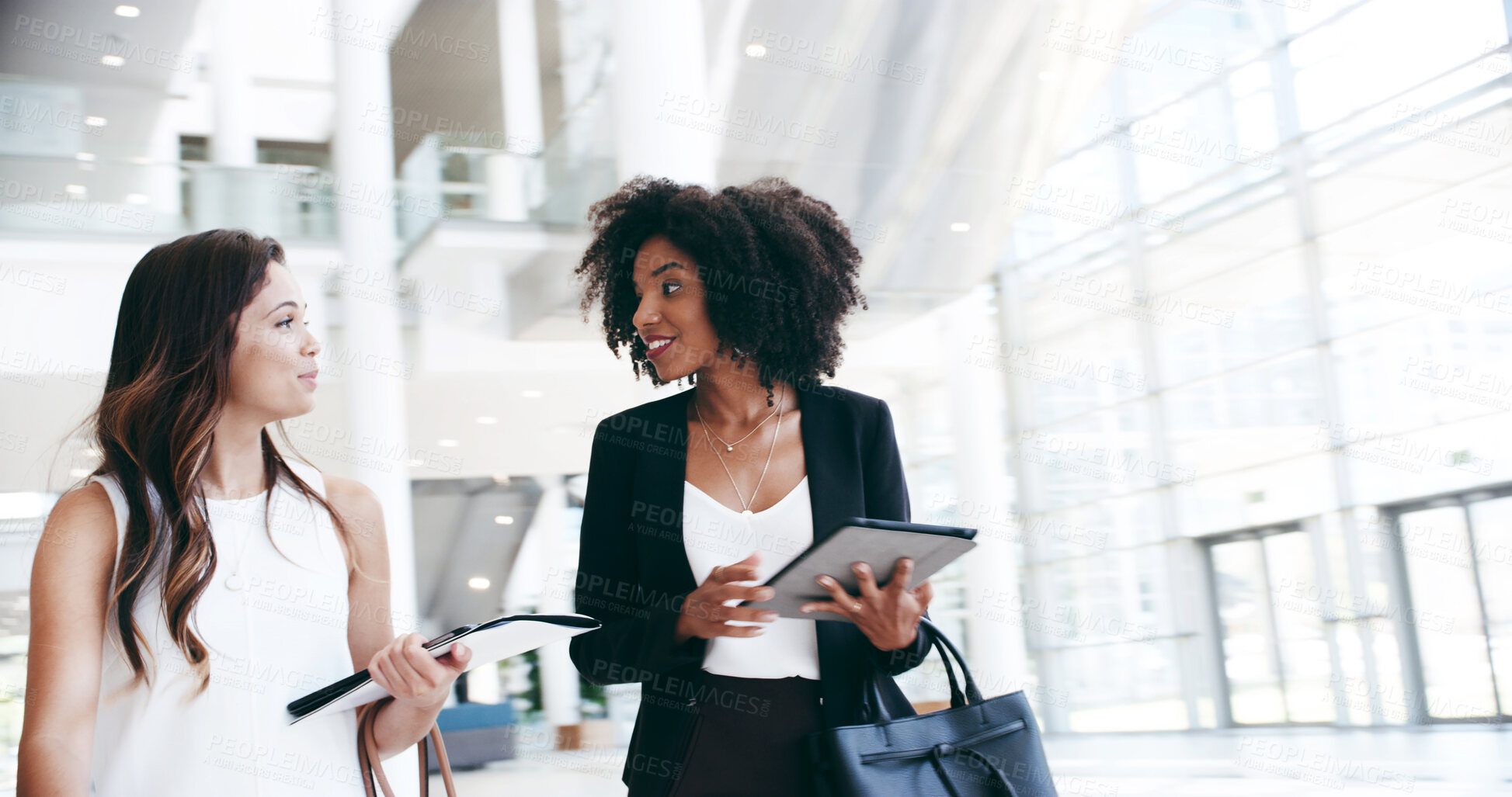 Buy stock photo Business women, smile and walking in lobby for opportunity, professional and career in news agency. Journalist, editor and tablet in office for company development, consultant or press for occupation