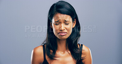 Buy stock photo Depression, crying and unhappy woman with stress for mental health crisis, disaster or broken heart. Sad face, anxiety and person with bad news, abuse victim or trauma on gray studio background space