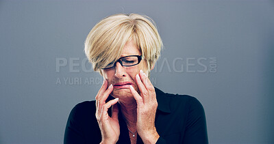 Buy stock photo Woman, grief and crying tears in studio with depression, mourning loss and emotional memory. Mature person, sorrow and mockup with mental health crisis, bad news and ptsd challenge on gray background