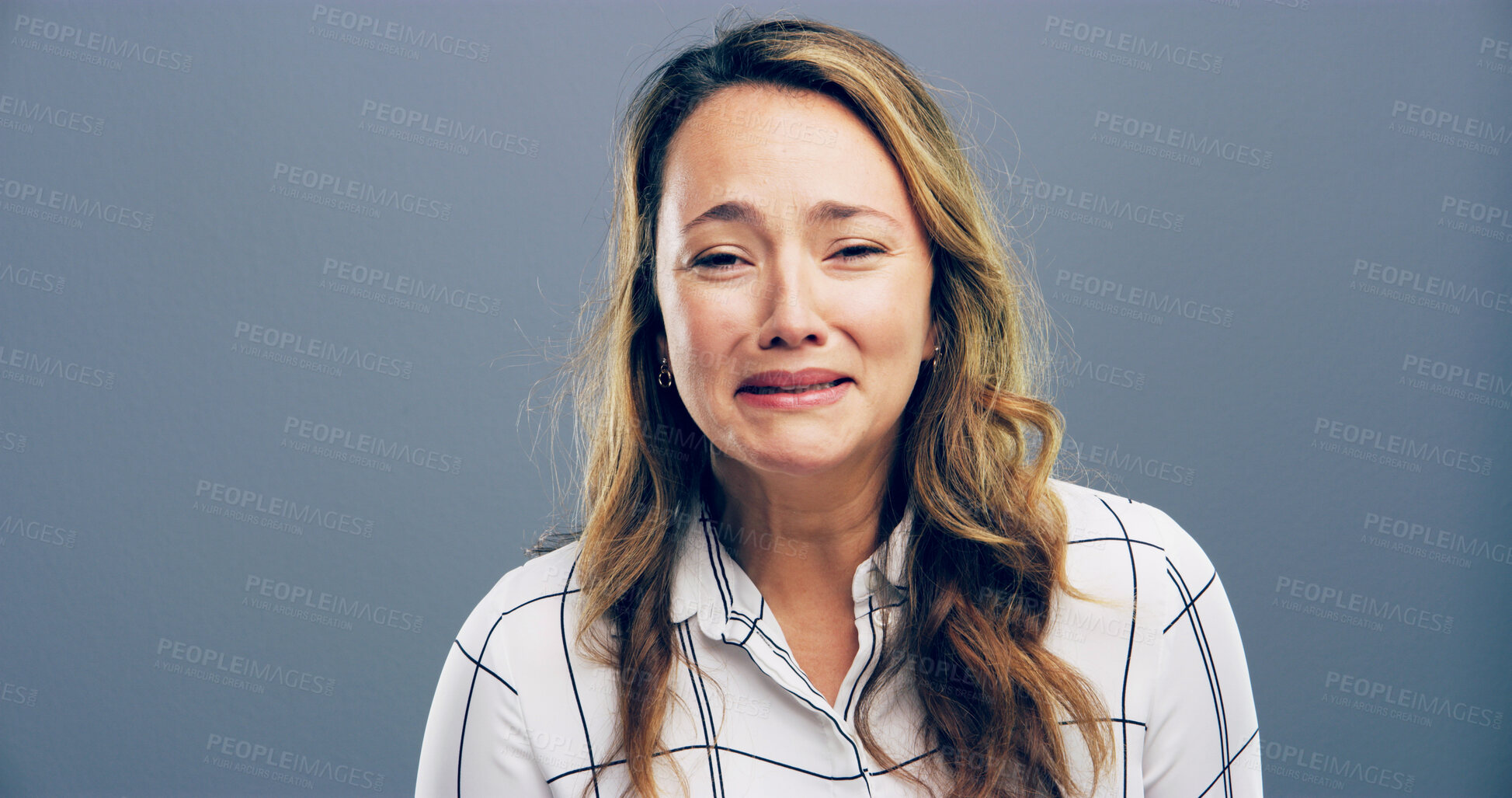Buy stock photo Depression, portrait and anxiety with woman in studio for mental health crisis, trauma or broken heart. Unhappy face, sad and person with bad news, stress or abuse victim cry on gray background space