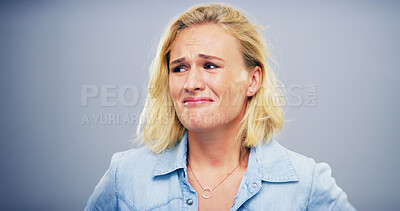 Buy stock photo Sad, crying and woman with depression, studio and emotional for loss of relationship, divorce and grief. Mockup space, blue background and person with heartbreak for breakup, disappointed and lonely