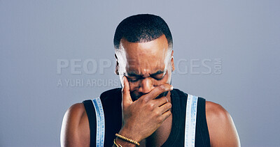 Buy stock photo Crying, sad and face of black man in studio with depression, heartbreak and emotional on blue background. Tears, mourning and person with grief, upset and unhappy for breakup, bad news and pain
