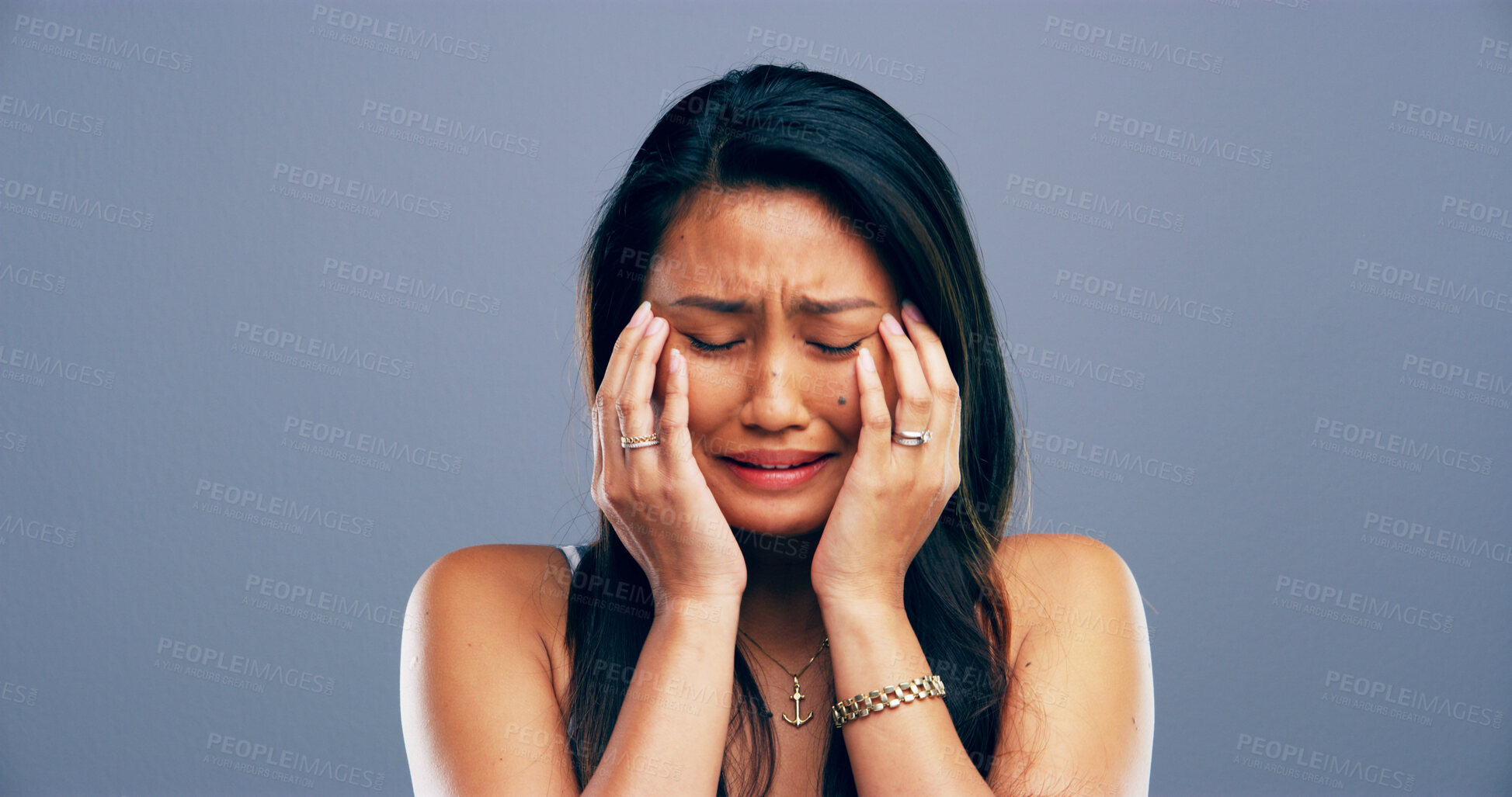 Buy stock photo Pain, crying and woman with depression, tears and emotional for loss of relationship, trauma and studio. Mockup space, blue background and person with heartbreak for breakup, disappointed and sad