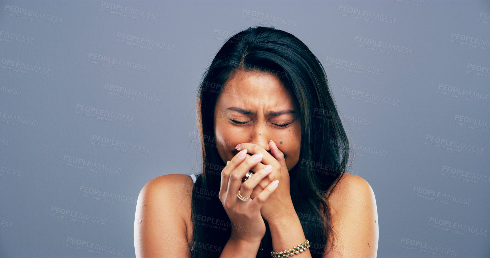 Buy stock photo Grief, crying and woman with heartbreak, studio and sad for loss of relationship, divorce and emotional. Mockup space, blue background and person with depression for breakup, disappointed and lonely