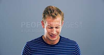 Buy stock photo Crying, sad and face of man in studio with depression, heartbreak and emotional on gray background. Tears, mourning and isolated person with grief, upset and unhappy for breakup, bad news and pain
