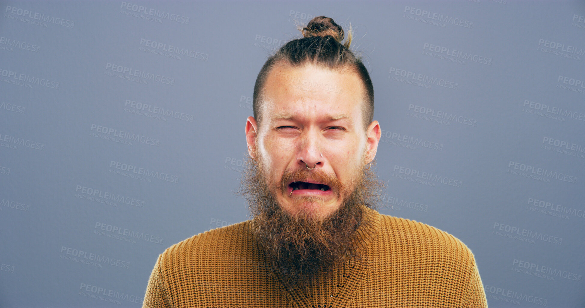 Buy stock photo Sad, crying and man with depression in studio for mental health, grief and loss with mockup space. Emotional, portrait and person on gray background for mourning, broken heart or trauma from bad news