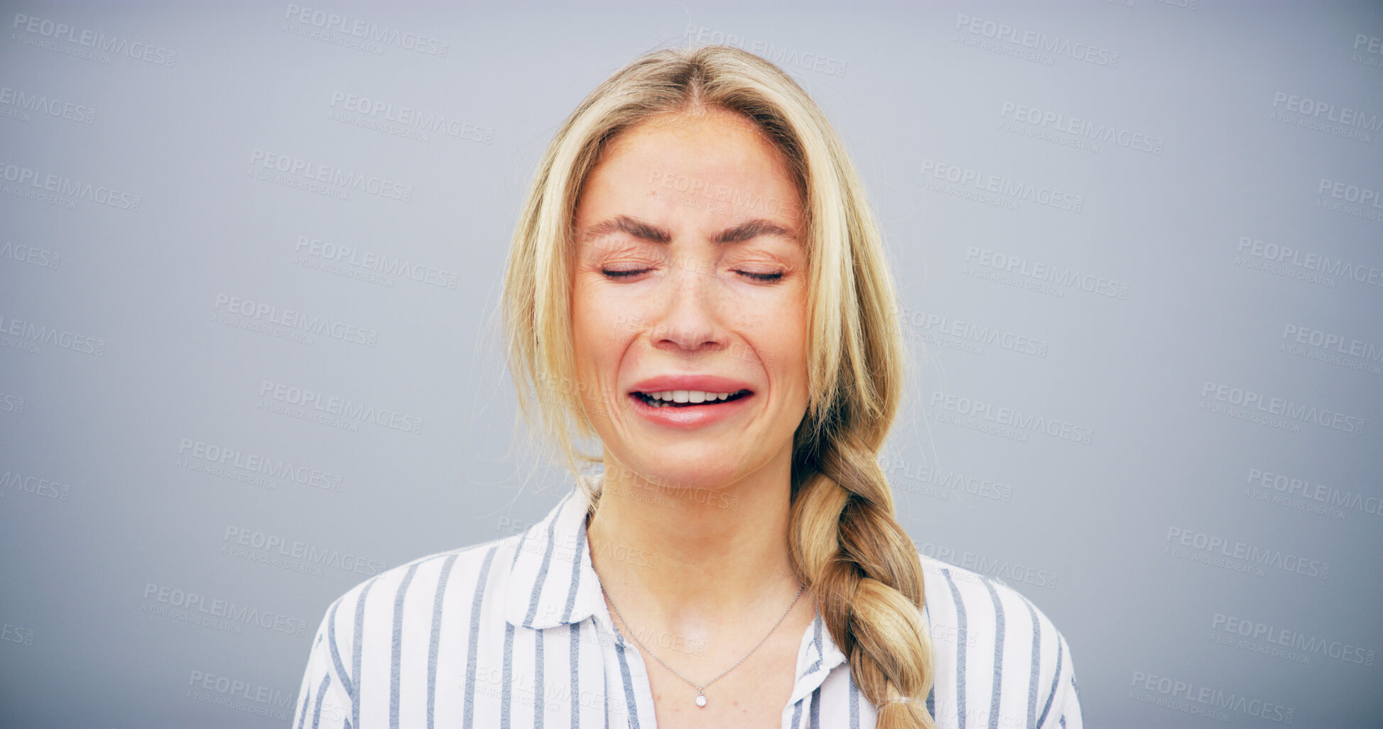 Buy stock photo Depression, woman and unhappy with crying in studio for sadness, sorrow and grief with mockup space. Emotional, person and pain on gray background for mourning, broken heart and trauma from bad news
