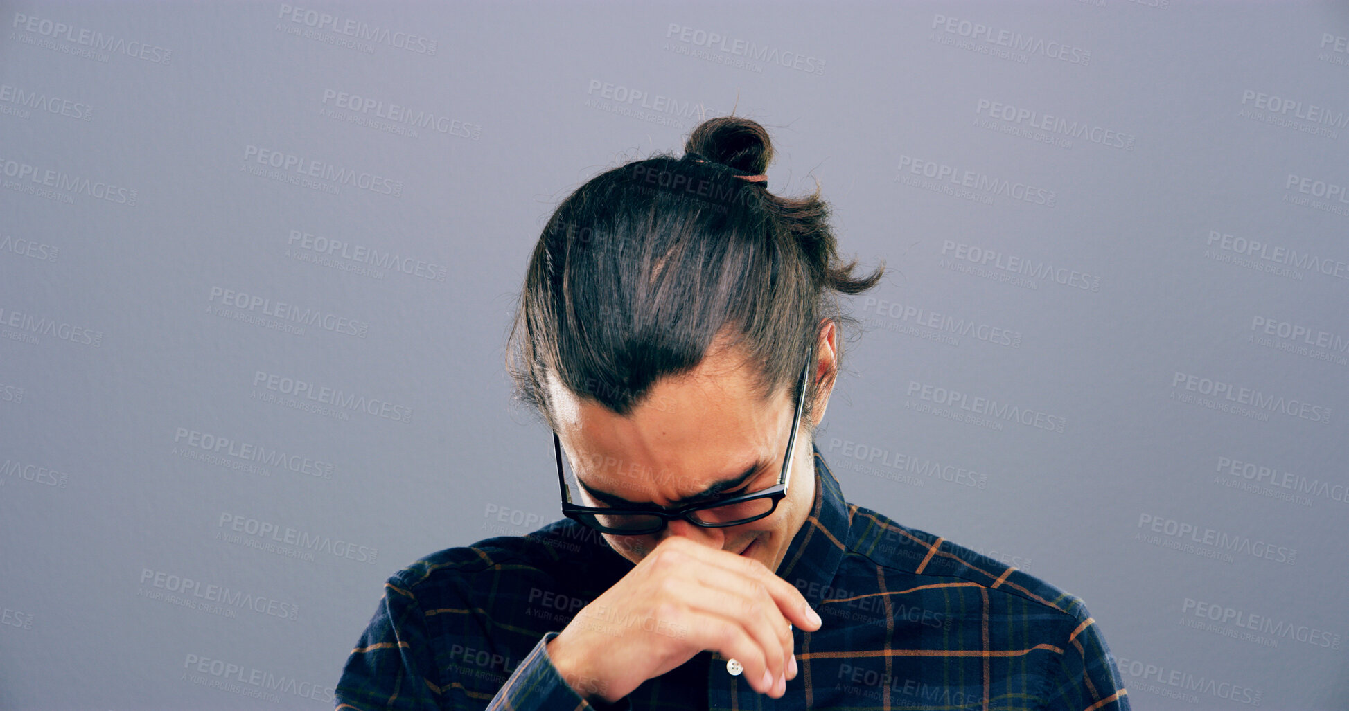 Buy stock photo Crying, sad and man in studio with emotions, heartbreak and grief on gray background space. Tears, mourning and isolated lonely person with depression, upset and unhappy for breakup, bad news or pain