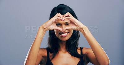 Buy stock photo Love, portrait and girl with heart hands in studio for appreciation, kindness and romance. Space, person and care gesture on gray background for support, gratitude and motivation sign with affection