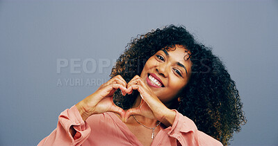 Buy stock photo Hands in heart, studio and portrait of black woman with gesture for support, kindness and care. Happy, space and person with emoji, sign and hope for thank you, charity and love on blue background