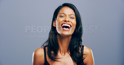 Buy stock photo Studio, woman and joke in portrait for laughing, funny memory and comedy with mockup space. Model, female person and happiness with humor by blue background, satisfaction and expression of emoji