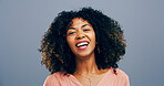Studio, woman and portrait with laughing for joke, funny memory or confident with comedy by space. African model, female person and happy with humor by blue background, satisfaction or emoji reaction