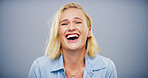 Studio, woman and comedy in portrait for laughing, funny memory and joke with mockup space. Model, female person and happiness with humor by blue background, satisfaction and expression of emoji