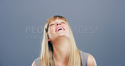 Buy stock photo Laughing, joke and face of woman in studio for comic, funny and silly with mockup space. Happiness, meme and comedy with female person on blue background for smile, humor and giggle reaction
