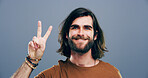 Man, peace sign and symbol in studio portrait, v icon and smile for victory by background. Model, person and excited with beard, happy and emoji with fashion, vote and hand gesture in Argentina