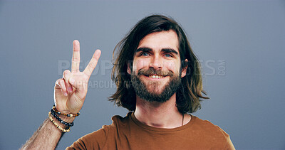 Buy stock photo Man, peace sign and symbol in studio portrait, v icon and smile for victory by background. Model, person and excited with beard, happy and emoji with fashion, vote and hand gesture in Argentina