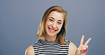 Woman, peace sign and fashion in studio with smile, icon and v symbol for victory by background. Person, portrait and happy with emoji, style and vote for human rights with hand gesture in Germany