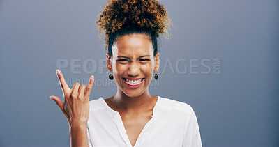 Buy stock photo Portrait, woman and rock hand gesture in studio for music, heavy metal and cool emoji for culture with tongue out. Smile, devil horns and person with symbol, sign or punk isolated on background space