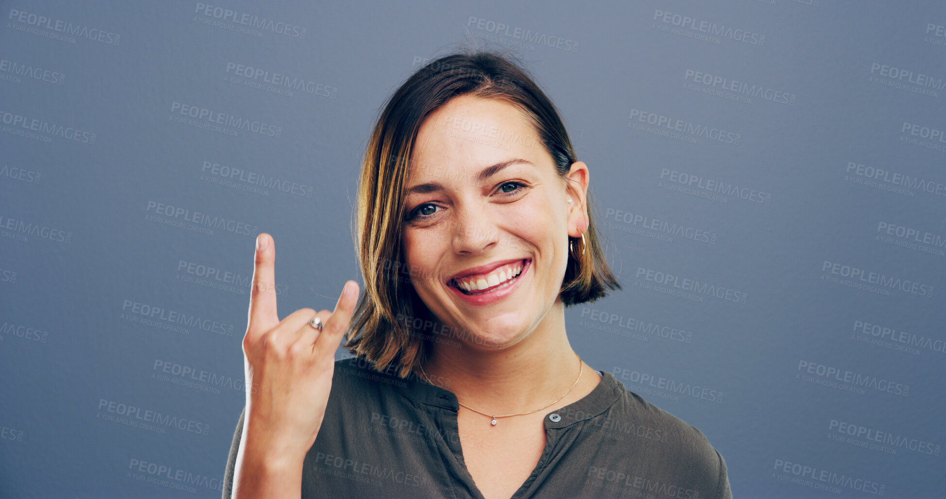 Buy stock photo Devil horn, hand and portrait of woman in studio for metal music, punk identity and smile. Rocker sign, edgy and attitude with happy person on background for girl, emoji and funky expression