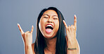 Rocker, hand and crazy with portrait of asian woman in studio for metal music, punk identity and crazy. Devil horn sign, edgy and attitude with person on background for energy, emoji and expression