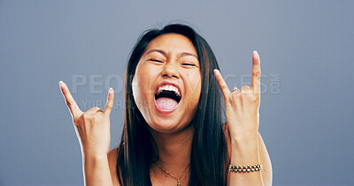 Buy stock photo Rocker, hand and crazy with portrait of Asian woman in studio for metal music, punk identity and crazy. Devil horn sign, edgy and attitude with person on background for energy, emoji and expression