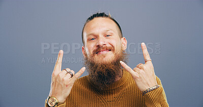 Buy stock photo Rocker, hand and cool with man in studio for metal music, punk identity and space. Devil horn sign, edgy and attitude with portrait of happy person on background for smile, emoji and expression