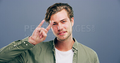 Buy stock photo Rocker, hand and edgy with man in studio for metal music, punk identity and smile. Devil horn sign, cool and attitude with portrait of happy person on background for energy, emoji and expression