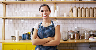 Buy stock photo Woman, crossed arms and portrait of waitress at coffee shop with confidence for hospitality career. Happy, server and female barista from New York with pride in startup cafe, restaurant or diner.