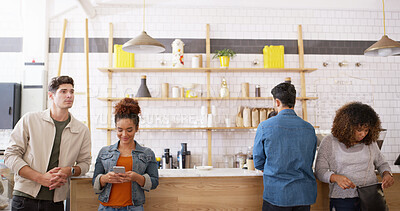 Buy stock photo Coffee shop, group and people waiting at counter with smartphone, small business or hospitality. Relax, customer or friends at trendy cafe for morning drinks, lunch break or online review for service