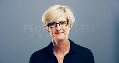 Buy stock photo Smile, portrait and mature businesswoman in studio with confidence for corporate career. Glasses, pride and female human resources manager from London with company compliance by gray background.