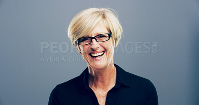 Buy stock photo Laugh, portrait and mature businesswoman in studio with confidence for corporate career. Glasses, pride and female human resources manager from London with company compliance by gray background.