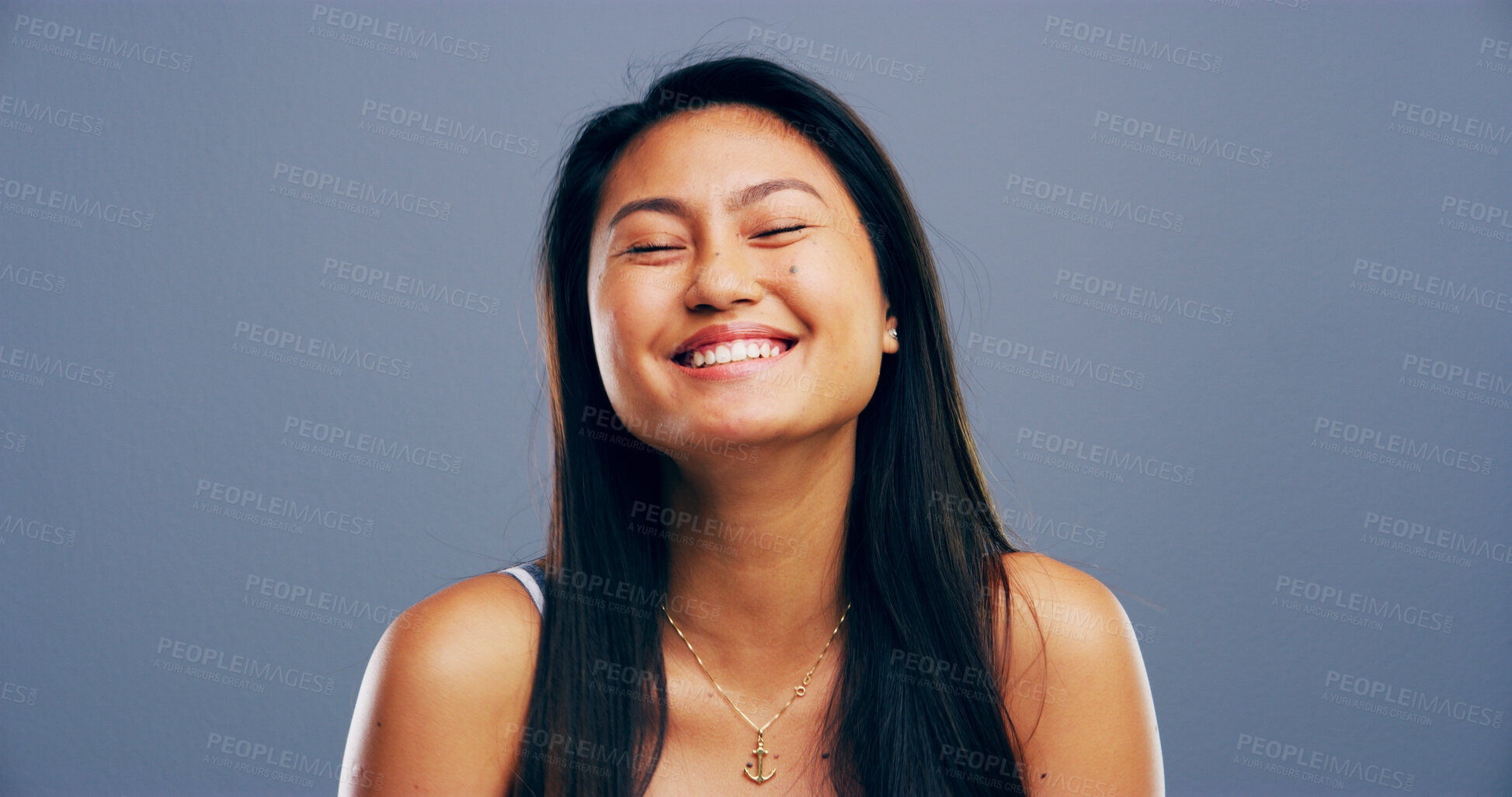 Buy stock photo Laughing, student and college with Asian woman in studio for gen z, education and scholarship. Future, happiness and university with female person on gray background for knowledge, academy and space