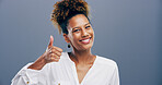 Happy woman, portrait and thumbs up with feedback in studio for opinion or good job on a gray background. Female person, model or smile with like emoji or yes sign for positive approval or success