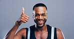 Thumbs up, success and portrait of black man in studio for approval, smile and feedback. Like emoji, yes sign and agreement with male person on background for vote, symbol and promotion icon 