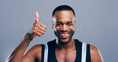 Buy stock photo Thumbs up, success or portrait of black man in studio for approval, smile or feedback. Like emoji, yes sign and agreement with male person on gray background space for vote, symbol or promotion icon 