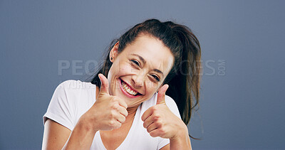 Buy stock photo Thumbs up, like and portrait of woman in studio for approval, success and feedback. Hand emoji, yes sign and agreement with female person and smile on background for vote, symbol and promotion icon 