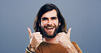 Thumbs up, winner and portrait of man in studio for approval, success and feedback. Like emoji, yes sign and agreement with male person and smile on background for vote, symbol and promotion icon 