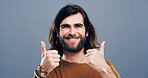 Thumbs up, hands and portrait of man in studio for approval, success and feedback. Like emoji, yes sign and agreement with male person and smile on background for vote, symbol and promotion icon 