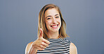 Thumbs up, smile and like with portrait of woman in studio for approval, success and feedback. Yes emoji, sign and agreement with female person on background for vote, symbol and promotion icon 