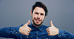 Thumbs up, smile and comic with portrait of man in studio for approval, success and feedback. Like emoji, yes sign and agreement with male person on background for vote, symbol and promotion icon 