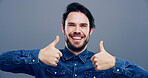 Thumbs up, smile and hands with portrait of man in studio for approval, success and feedback. Like emoji, yes sign and agreement with male person on background for vote, symbol and promotion icon 