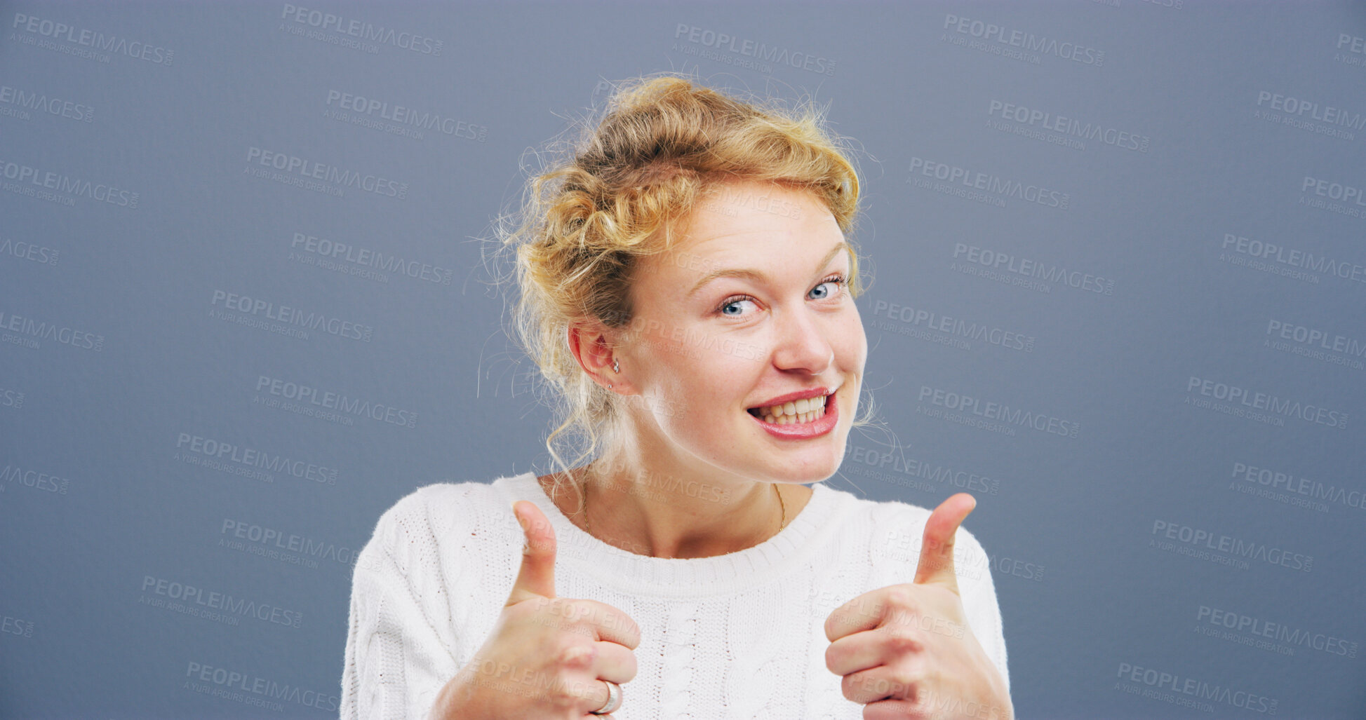 Buy stock photo Happy woman, portrait or agreement with thumbs up for reaction on a gray studio background. Female person, model or smile with like emoji, gesture or yes sign for positivity, approval or satisfaction