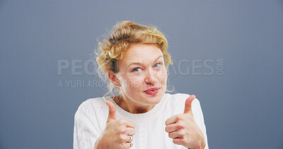 Buy stock photo Woman, portrait or agreement with thumbs up for positive reaction on a gray studio background. Female person, model or like emoji with gesture, icon or yes sign for good job, approval or satisfaction