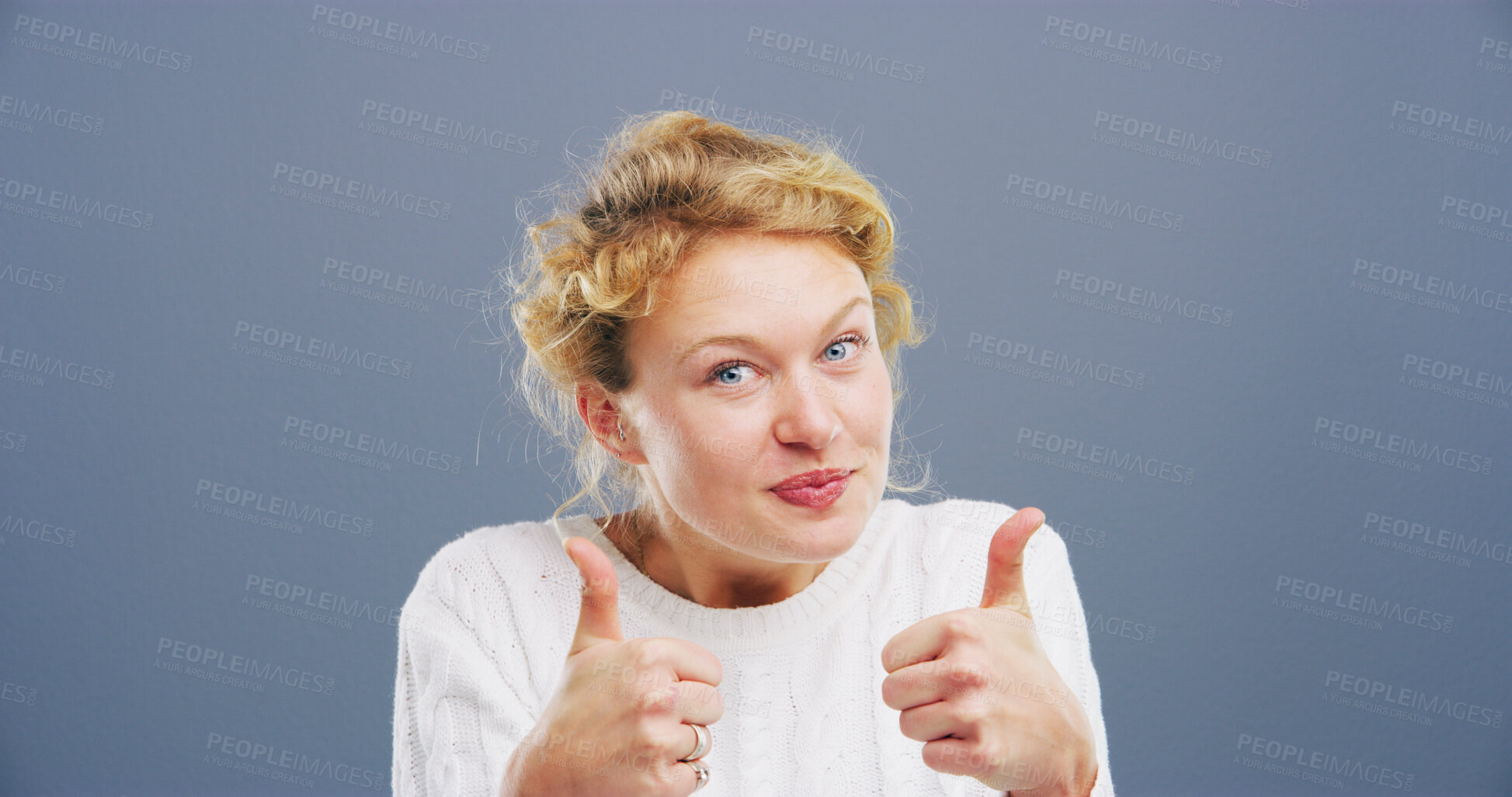 Buy stock photo Woman, portrait or agreement with thumbs up for positive reaction on a gray studio background. Female person, model or like emoji with gesture, icon or yes sign for good job, approval or satisfaction