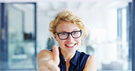 Happy woman, portrait and creative designer with thumbs up at office for good job or well done. Face, female person or glasses with smile, like emoji or yes sign for okay, approval or great work